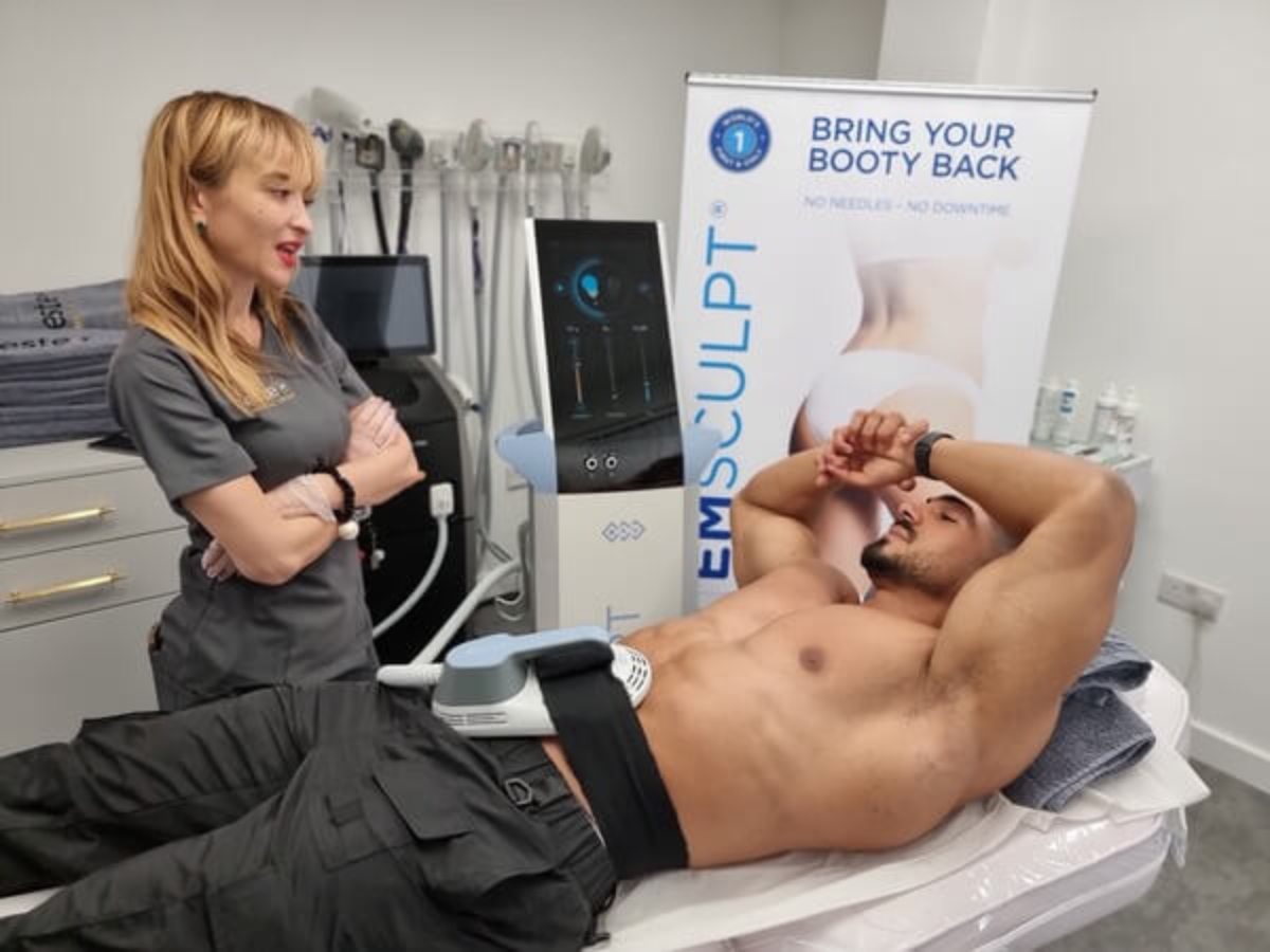 Client receiving an EmSculpt muscle toning treatment